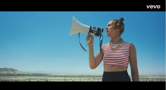 MO (Karen Marie Osted) in the "XXX88" video. The song features Diplo, which is what she's calling out in the megaphone.