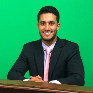 A photo taken from Nick Serrano's Facebook profile as he smiles for the camera at his head anchor desk for UCTV channel 14 News (Photo Cred: Nick Serrano)