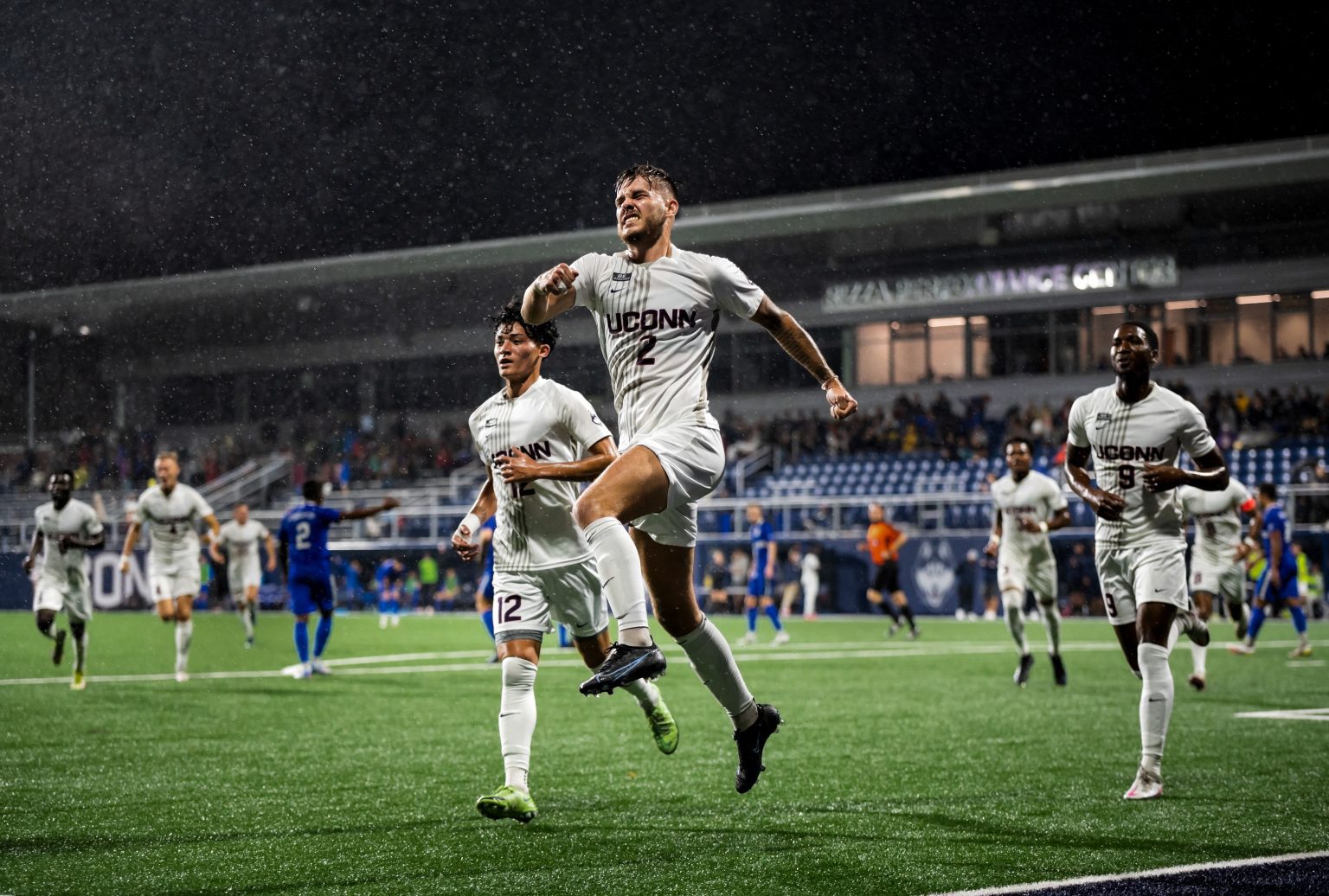 UConn Men’s Soccer midfielder Mateo Leveque celebrates after scoring a goal off a penalty kick during UConn’s 2–2 tie against Creighton University on Oct. 16, 2021 in rainy conditions at Morrone Stadium. Photo by Kevin Lindstrom Congratulations to UConn Senior Kevin Lindstrom for placing in the Top 20 of the 2021-22 Hearst Journalism Awards Photo One Competition. Lindstrom serves as photo editor of The Daily Campus and is a student of UConn Journalism Prof. Steve Smith.