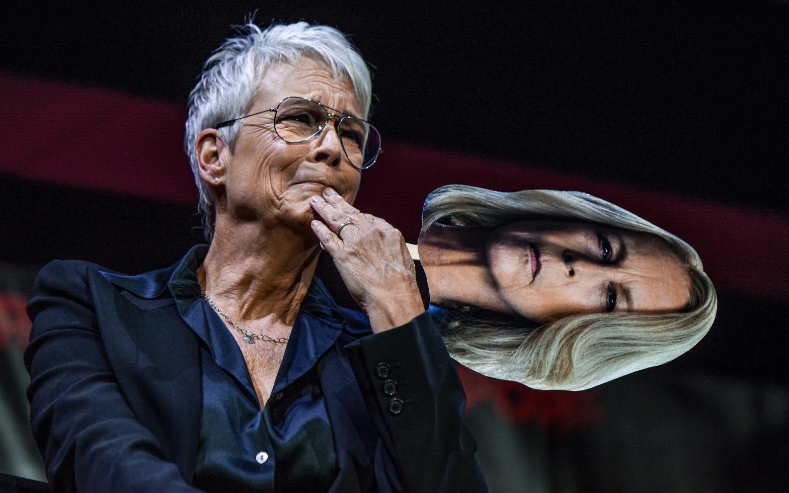 Actor Jamie Lee Curtis tears up while holding a picture of her “Halloween” film character at a New York Comic Con panel at the Jacob Javits Convention Center on October 8, 2022. The panel was dedicated to discussing Curtis’ four decades of experience with the “Halloween” film franchise. (Sofia Sawchuk/UConn Journalism)