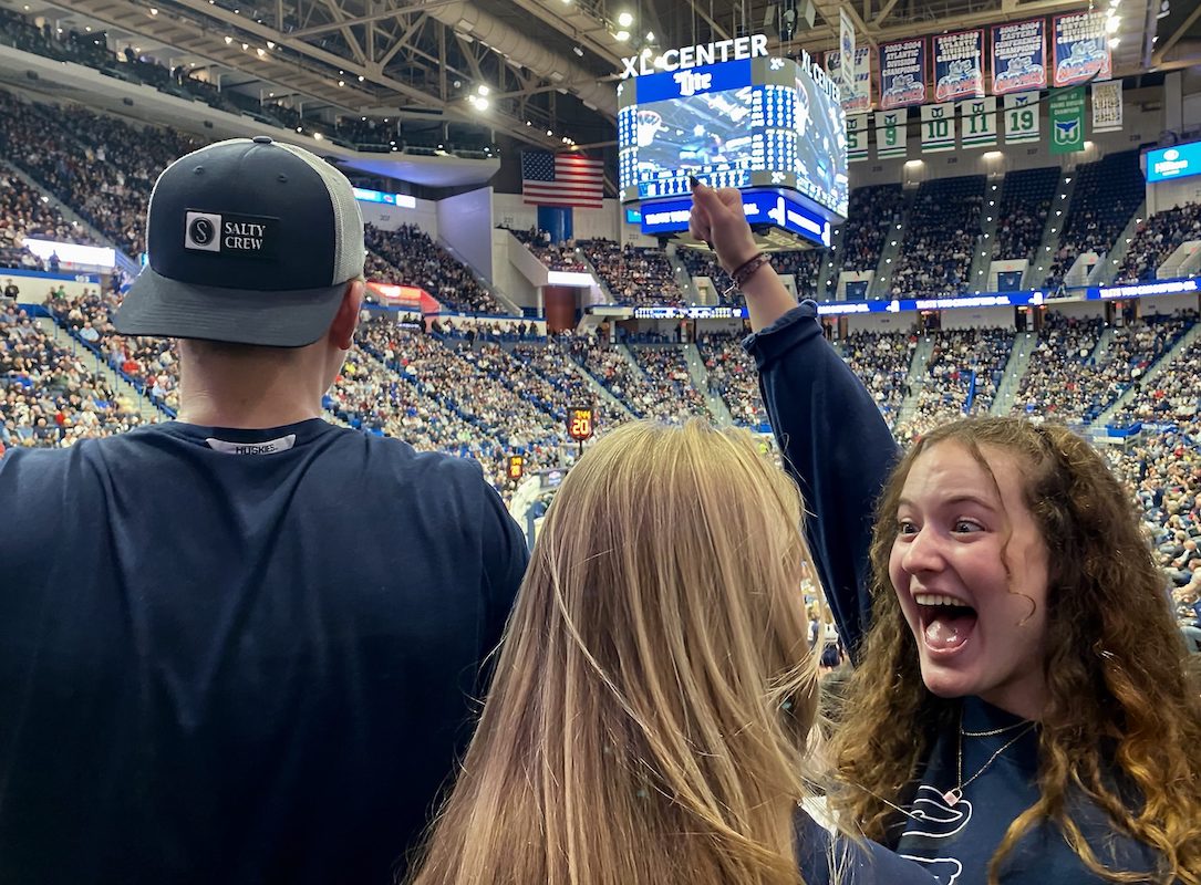 UConn Junior Riley Cigal celebrates with friends during a timeout at the UConn Men’s Basketball game at the XL Center in Hartford, Conn., Tuesday, Feb. 22, 2022. Photo by John Leahy ’23